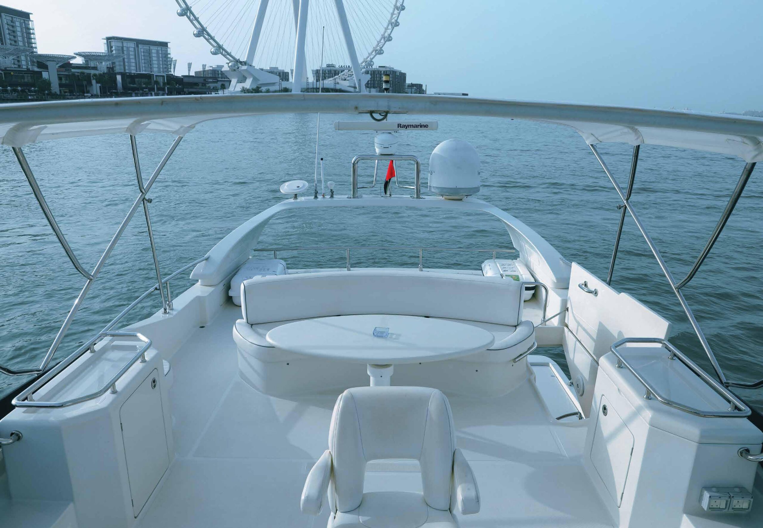 66 ft yacht sailing smoothly under a clear blue sky